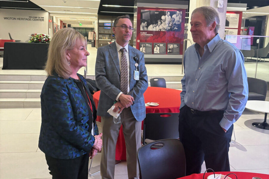 Julie Vose&comma; MD&comma; speaks with Nebraska Medicine CEO Michael Ash&comma; center&comma; MD&comma; and her husband&comma; Jeff Hageman&period;