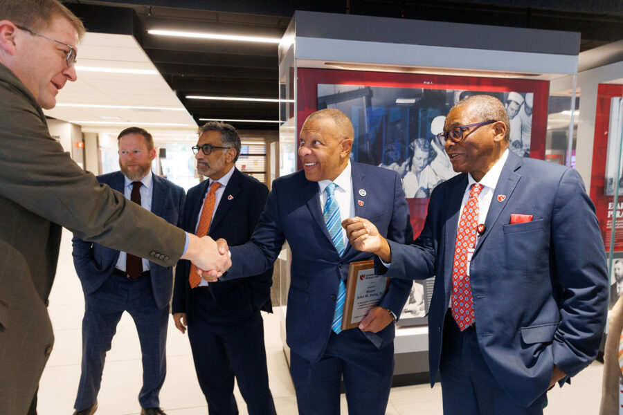 Mayor John W&period; Ewing Jr&period; delivered a proclamation that declared Feb&period; 23 &OpenCurlyDoubleQuote;UNMC Community Engagement Day&period;&rdquo; Here&comma; he meets Phil Covington&comma; EdD&comma; UNMC's associate vice chancellor for student success&comma; with Interim Chancellor H&period; Dele Davies&comma; MD&comma; at right&period;