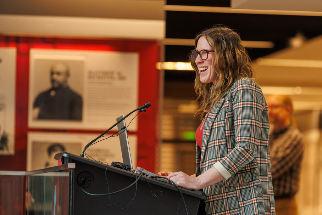 Heidi Keeler, PhD, speaks at a podium.
