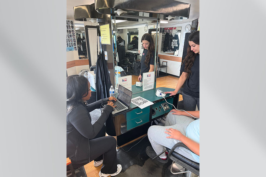 At right&comma; UNMC student Ashley Clegg&comma; UNMC College of Medicine&comma; takes a participant's blood pressure while working with&nbsp;Zoe Obamwonyi&comma; UNMC College of Nursing&period;