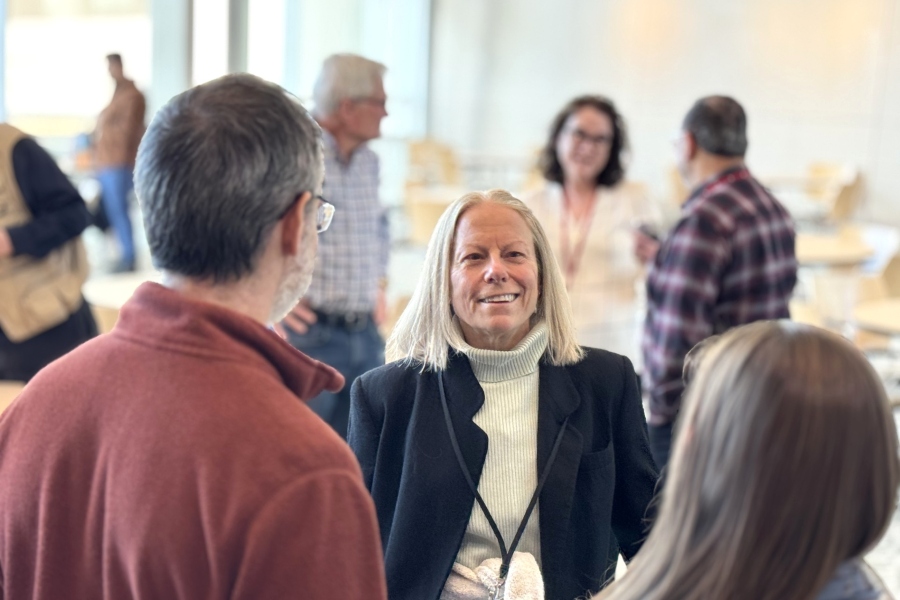 Marilyn Larson&comma; PhD&comma; visits with Drs&period; Scot Ouellette and Lisa Rucks at her retirement reception&period;