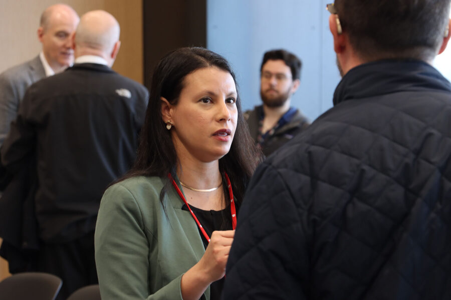 Agnes Lenagh&comma; PhD&comma; speaks with an attendee at a February "Idea Pub&colon; Morning Edition&period;"