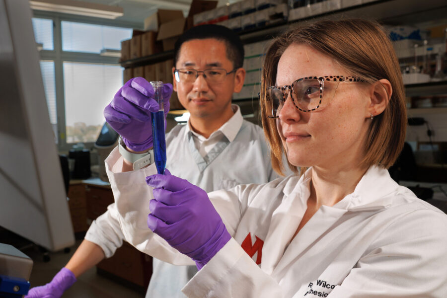 Hanjun Wang&comma; MD&comma; vice chair of research in the department of anesthesiology&comma; in his lab with research technician Reese Wilcox