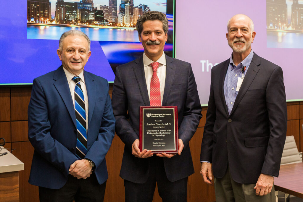 From left, Marco Olivera-Martinez, MD, the Michael F. Sorrell Distinguished Chair in Internal Medicine, guest lecturer Andres Duarte-Rojo, MD, professor of medicine (gastroenterology and hepatology) and surgery (organ transplantation) at Northwestern University in Chicago, and Mark Rupp, MD, interim chair of the UNMC Department of Internal Medicine