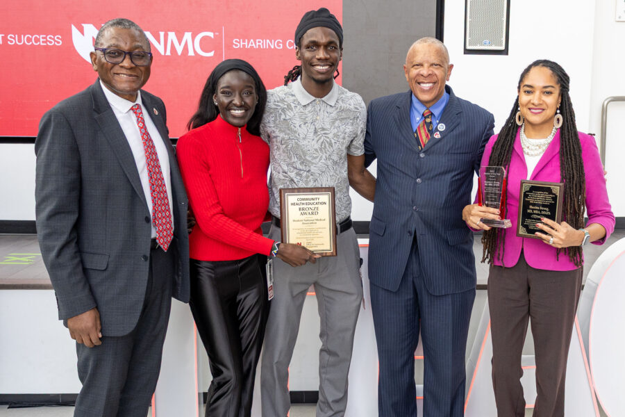 From left&comma; UNMC Interim Chancellor H&period; Dele Davies&comma; MD&semi; UNMC medical students Winnie Ladu and Omar Ceesay&semi; Omaha Mayor John Ewing Jr&period;&semi; and Vice Chancellor for Campus Engagement Sheritta Strong&comma; MD&period; &lpar;Photo credit Lily Butler&rpar;