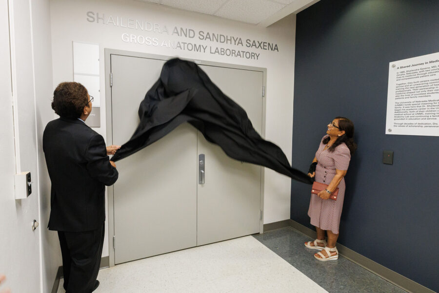 Shailendra and Sandhya removed the banner to unveil the Shailendra and Sandhya Saxena Gross Anatomy Laboratory during a May 1 dedication ceremony&period;