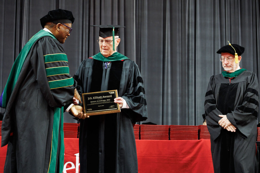 UNMC Interim Chancellor H. Dele Davies, MD, awards the J.G. Elliott Award to James Armitage, MD.