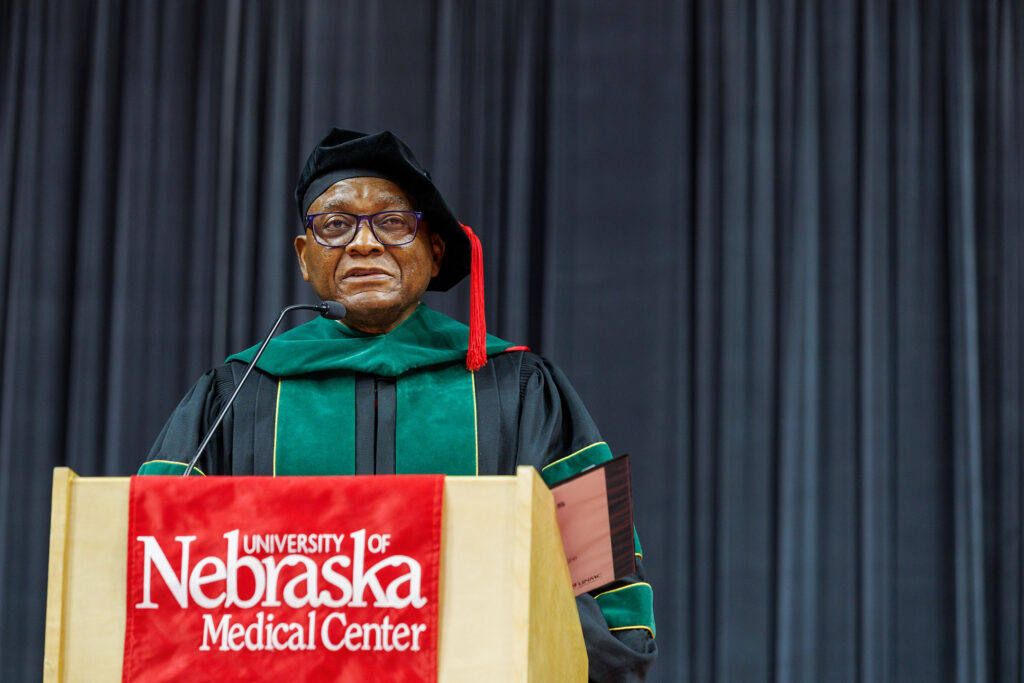 UNMC Interim Chancellor H. Dele Davies, MD, speaks at the May 9 commencement ceremony in Omaha.