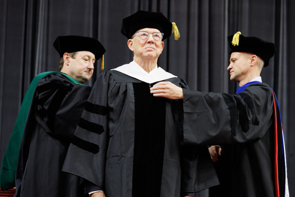 James Roudebush, MD, receives an honorary Doctor of Science degree for achievement in health care and service to our nation.