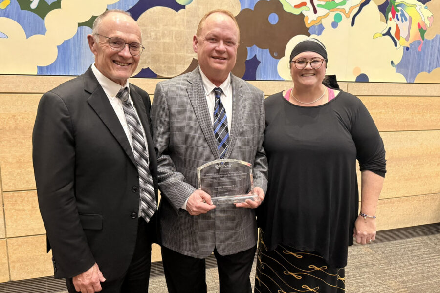 UNMC Department of Family Medicine Chair Dr. Jeff Harrison, Koefoot Award Winner Dr. Scott Ehresman, UNMC Department of Family Medicine Medical Student Education Director Dr. Mindy Lacey pose for a photo.