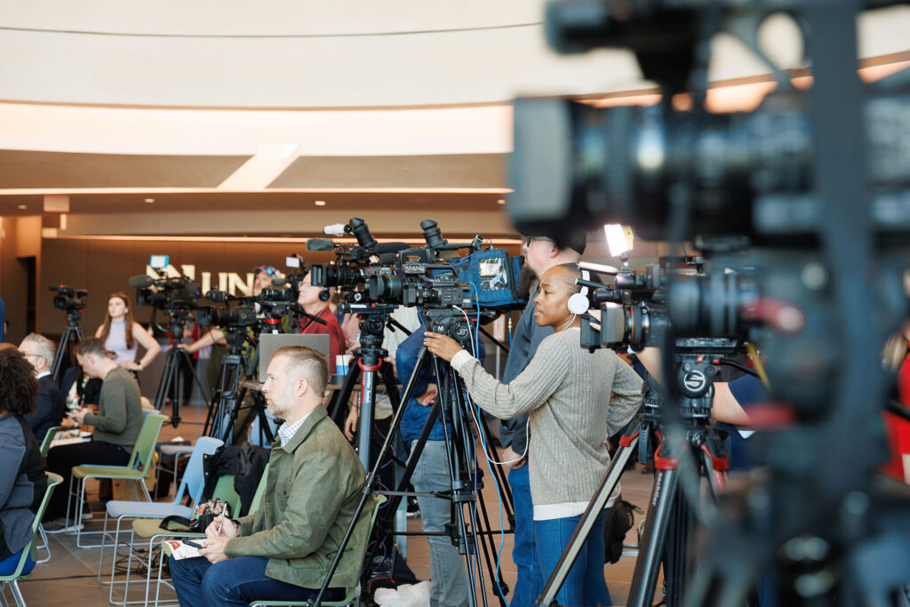 News media and television cameras are shown at a press conference that was held Monday May 11, 2026, at the Davis Global Center to give an update on the 16 passengers from the Hondius cruise ship who were moved to the quarantine and biocontainment units at UNMC.