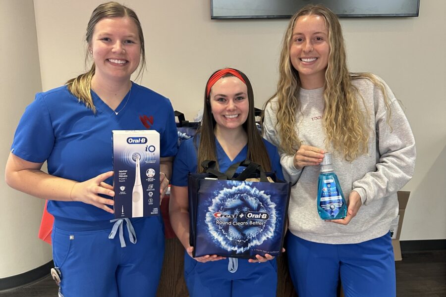 UNMC dental hygienist students Cori Combs&comma; Addison Knoll and Hannah Parsley&nbsp;were among SADHA members who used grant funds to help educate UNL students on oral health&period;