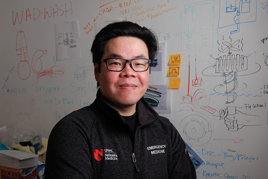 Thanh Nguyễn, PhD, is a member of the Department of Emergency Medicine and is a prolific inventor. A couple of his inventions are now on the market and others are being shared open source. Portraits in his office with his concept wall and with a few of his inventions including the Rapid Smear and Project FreeAir.