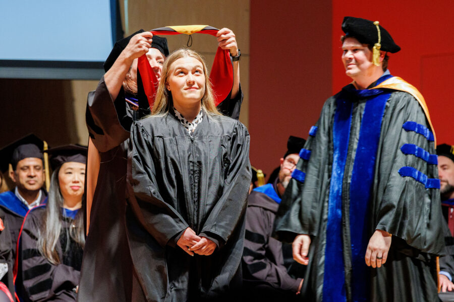 The hooding ceremony for graduates is a traditional part of the UNMC Graduate Studies Honors Convocation&period;