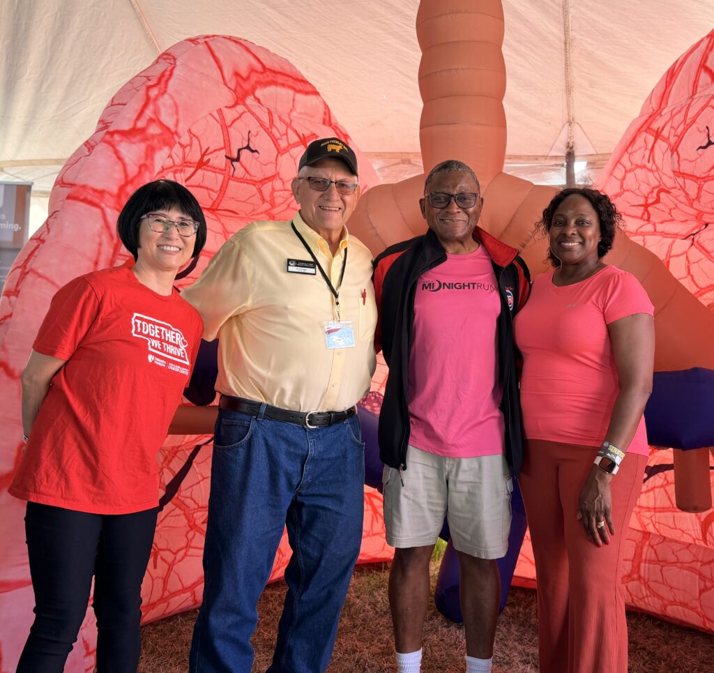 group photo next to inflatable lung