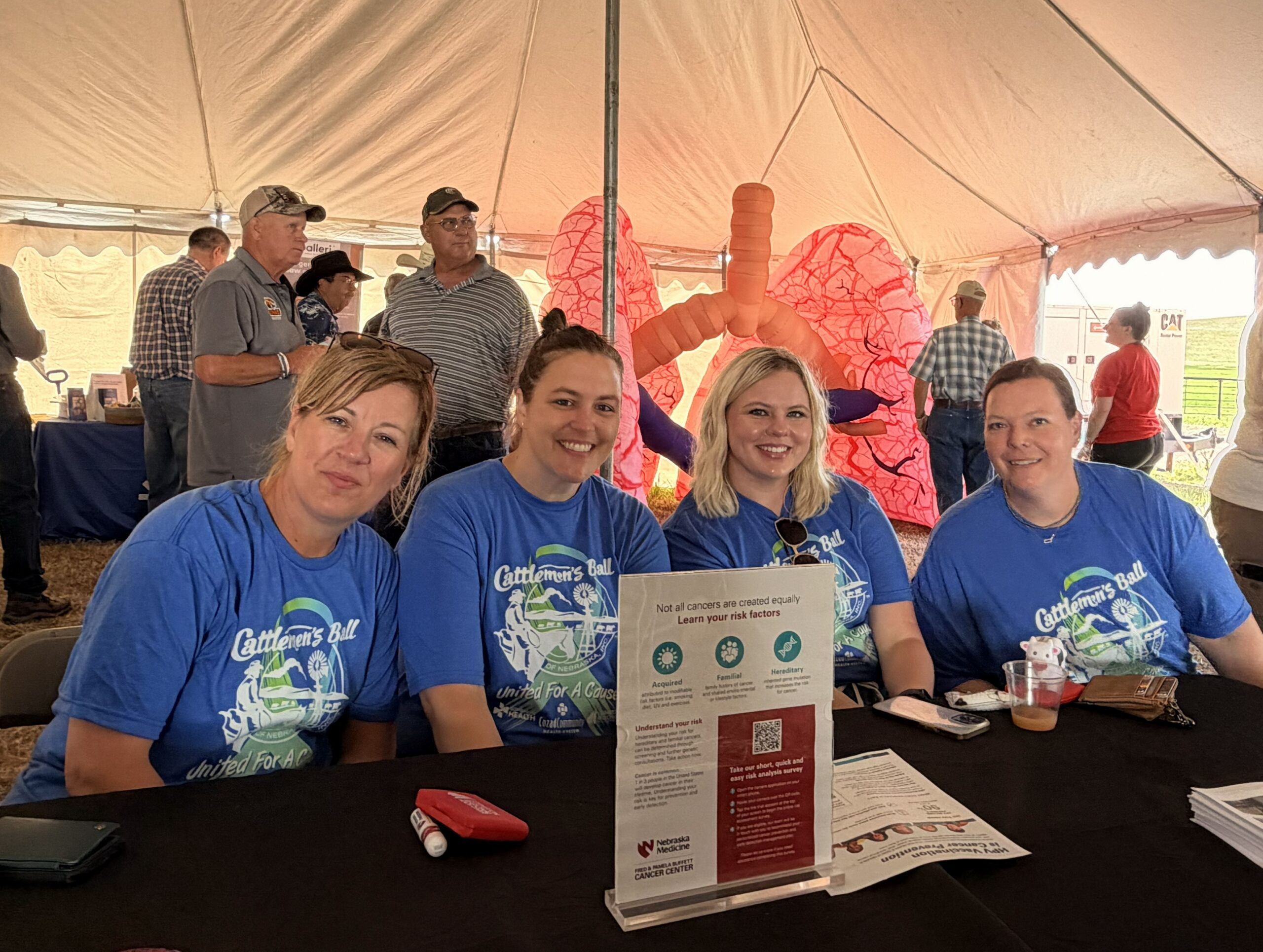 Cattlemen's Ball workers seated at a table