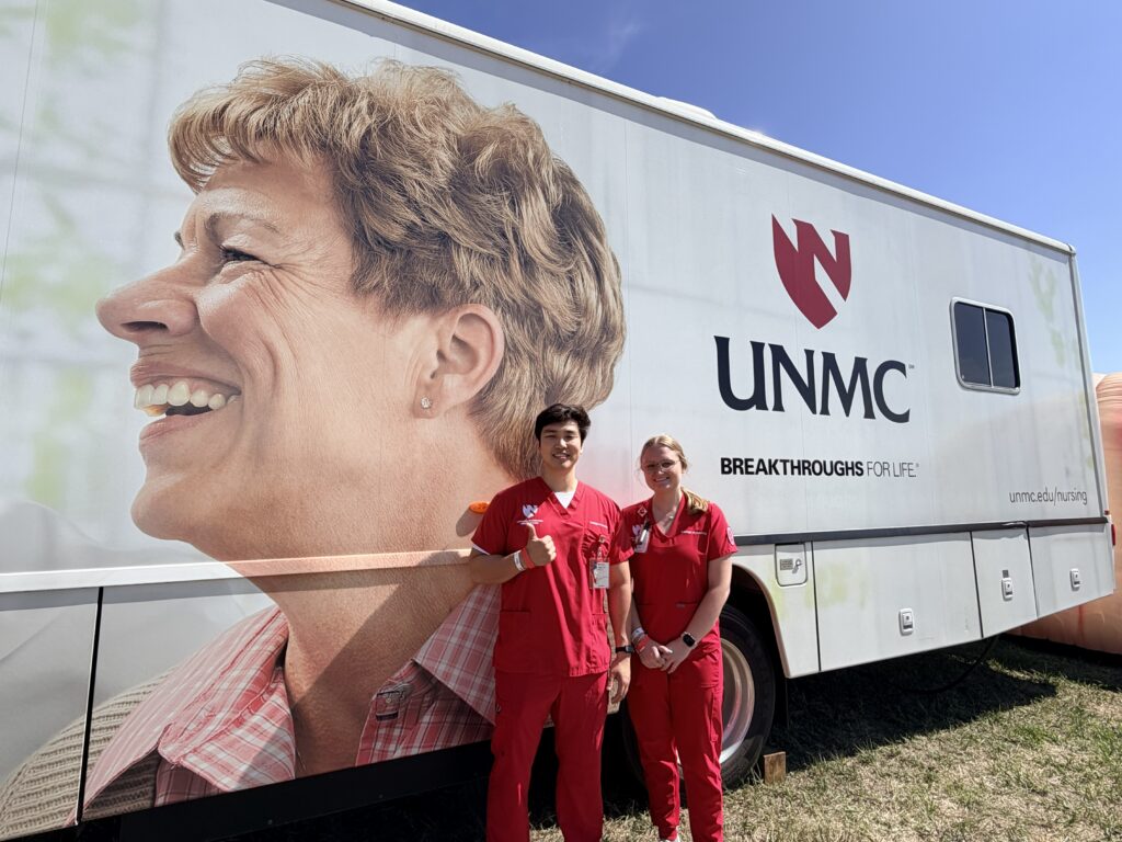 Nurses next to blood draw bus