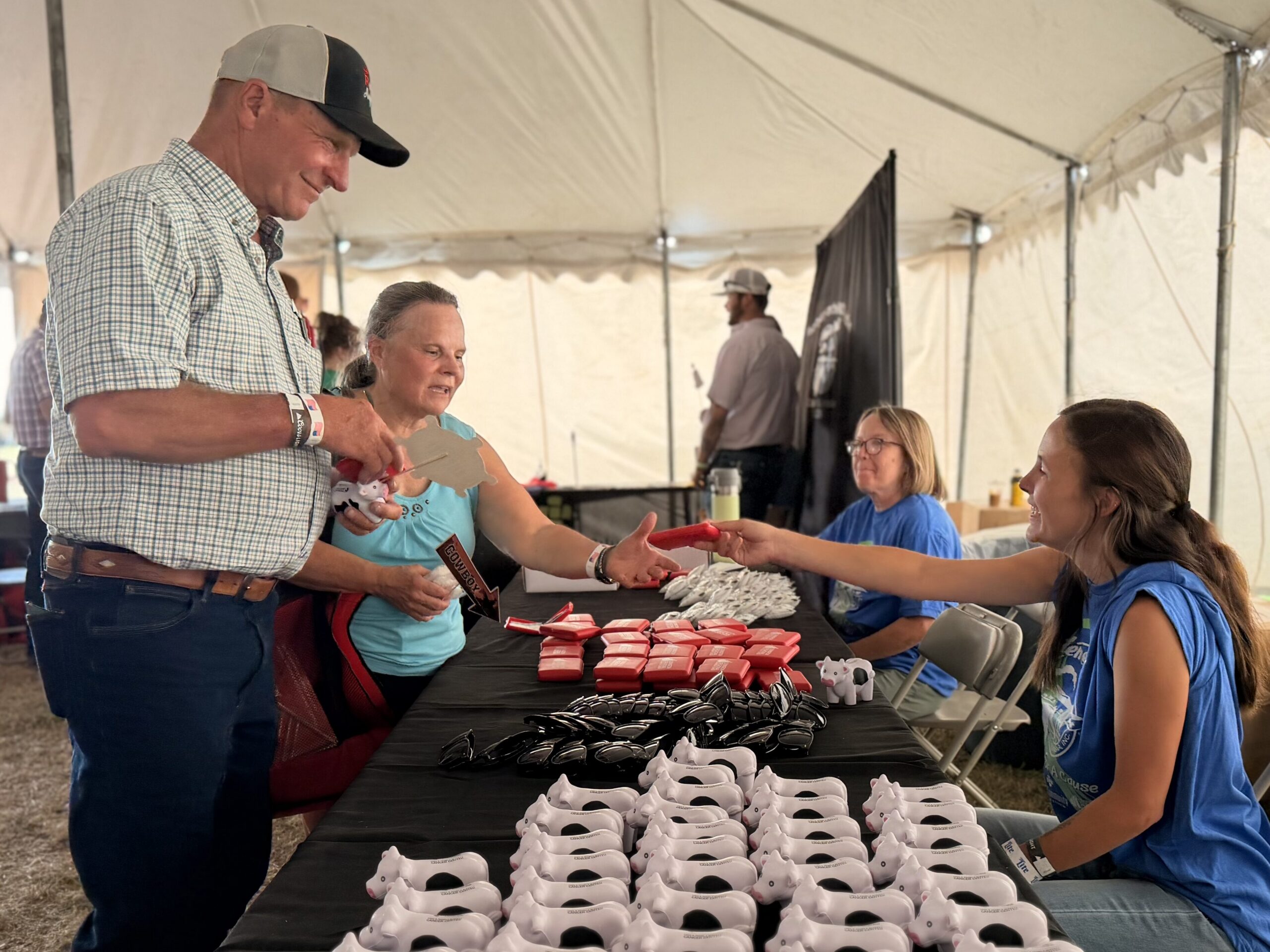 Attendees interacting with booths