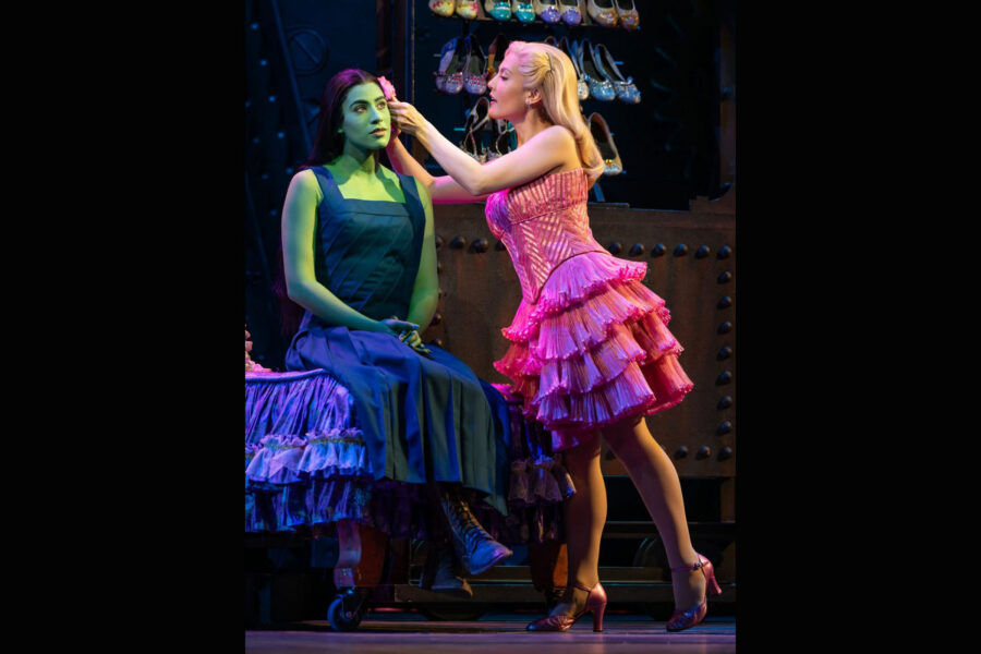 Promotional image from the musical Wicked, featuring Elphaba and Glinda.