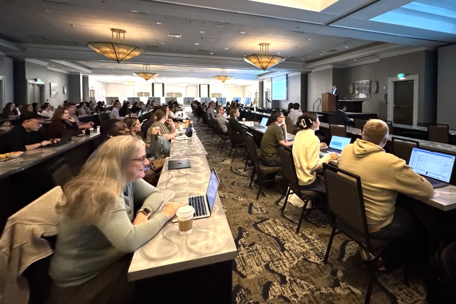 Large conference room full of people at tables