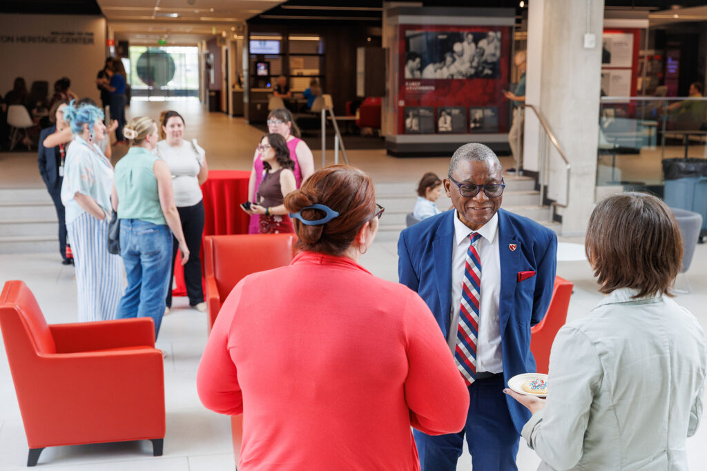 Dr. Davies talks with UNMC colleagues as the UNMC community marked America’s 250 years of independence Tuesday afternoon with a reception and a spotlight on McGoogan Health Science Library’s new historical exhibit. Faculty, staff and students were invited to join UNMC Interim Chancellor H. Dele Davies, MD, for cookies and refreshments in the Dr. Leland and Dorothy Olson Atrium, on the fourth floor of the Wigton Heritage Center.