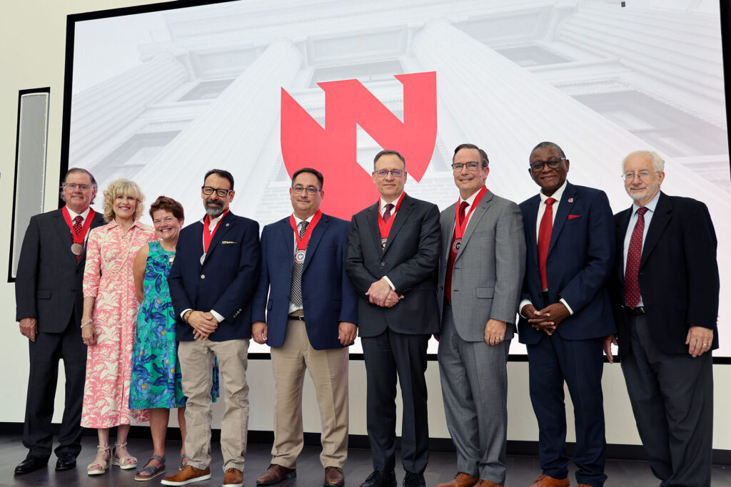 From left: Mike Meyer, Dana Meyer, Juliette Lisco, Steven Lisco, MD, Jim Sullivan, MD, Andrew Patterson, MD, PhD, Daniel Johnson, MD, Chancellor H. Dele Davies, MD, Bradley Britigan, MD