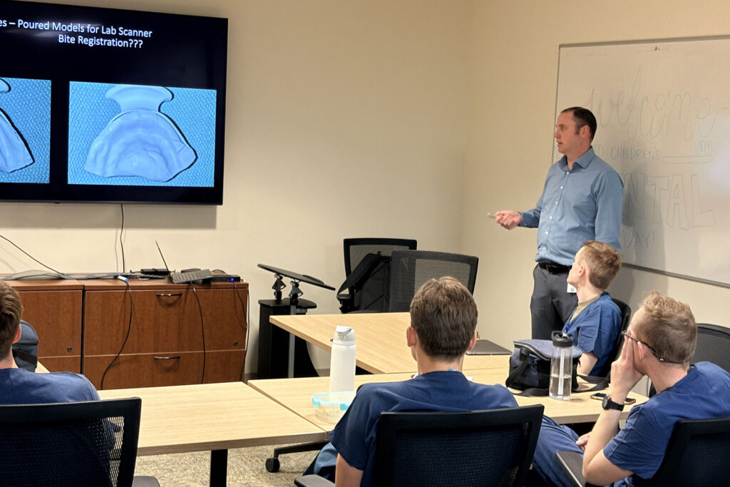 Gregory Bennett, DMD, gives a presentation to Offutt Air Force Base's Advanced Education in General Dentistry (AEGD) residents.