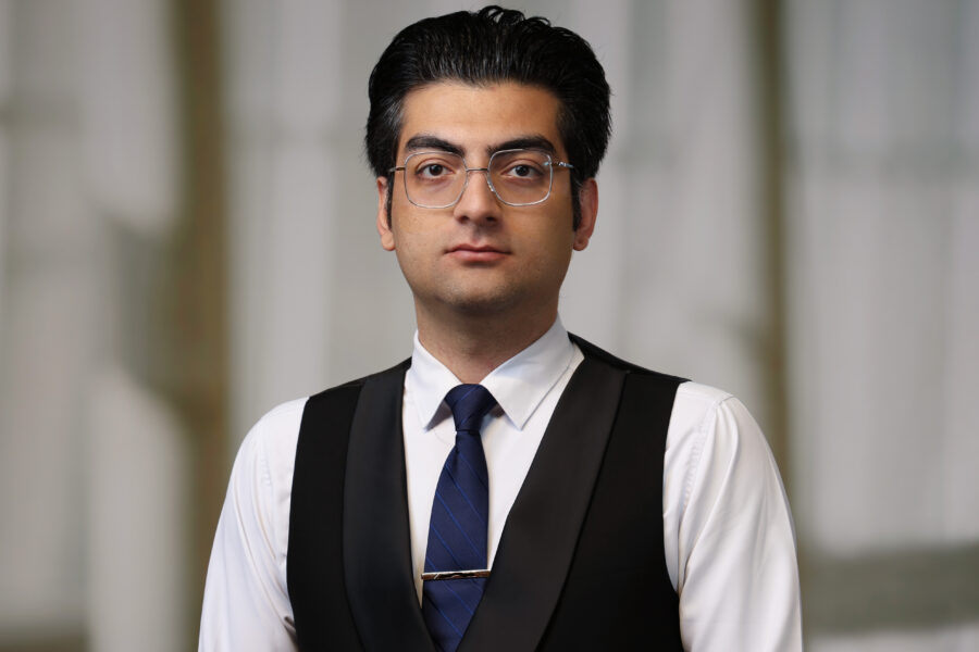 Foroughi Nezhad headshot in dark vest and tie.