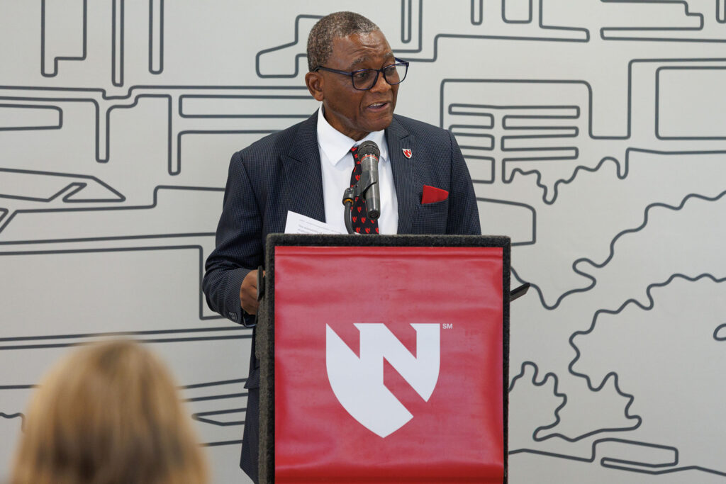 A ribbon cutting event was held Friday July 17, 2026, for the new student housing building on the University of Nebraska Medical Center campus. Here, UNMC Chancellor H. Dele Davies, MD, speaks at a podium.