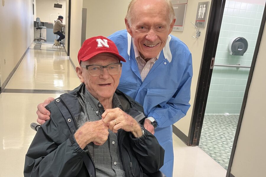 Gerald Tussing&comma; DDS&comma; professor of surgical specialties&comma; periodontics&comma; right&comma; posed with emeritus faculty member Uhl Donovan&comma; DDS&comma; seated&comma; during Dr&period; Donovan's recent visit to the UNMC College of Dentistry&period; Dr&period; Donovan died June 27 at the age of 92&period;