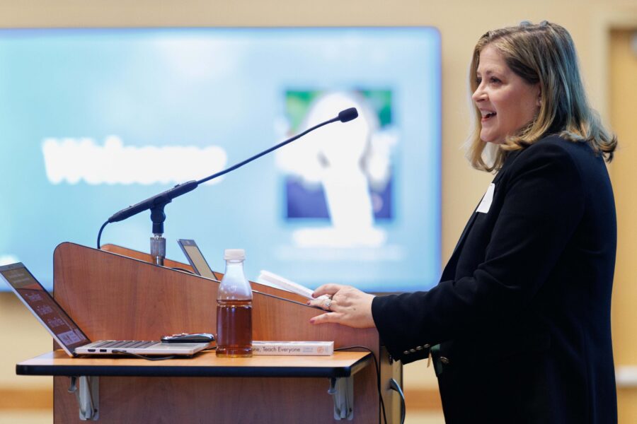 Jane Meza, PhD, speaks at a podium during the third annual InnovatED Symposium on Sept. 30, 2025, in the Truhlsen Event Center.