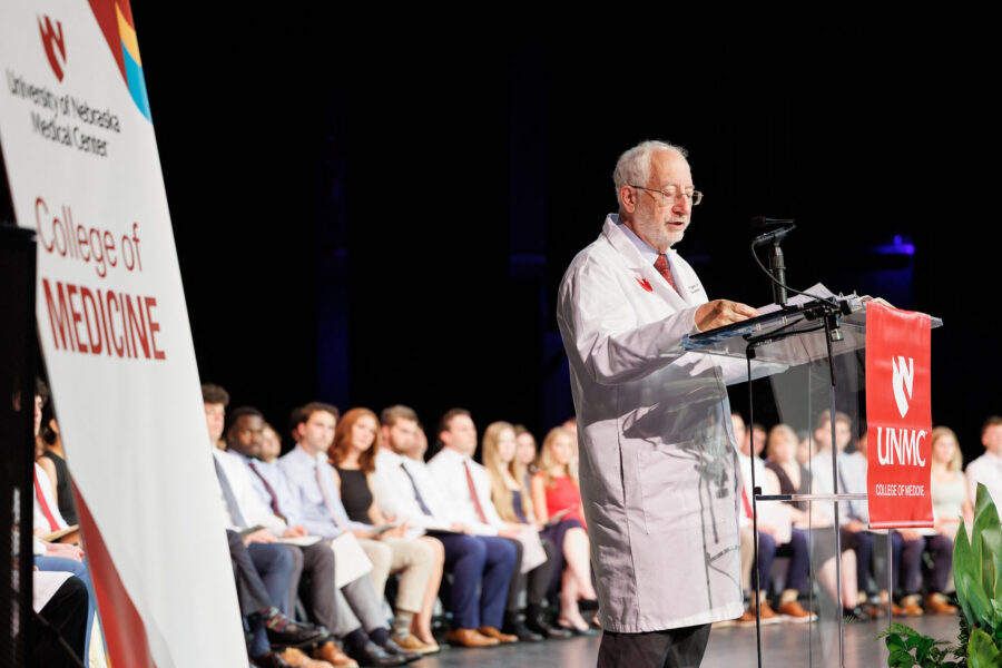 UNMC College of Medicine Dean Bradley Britigan&comma; MD&comma; speaks at the podium during the college's 2026 White Coat Ceremony&period;