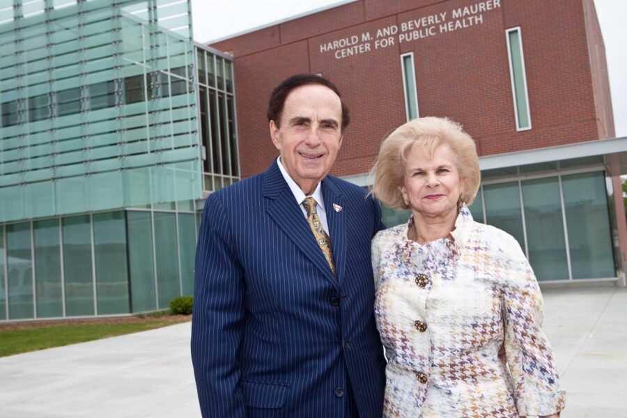Harold M&period; Maurer&comma; MD&comma; and his wife&comma; Beverly Maurer stand in front of the Maurer Center for Public Health on the UNMC Omaha campus