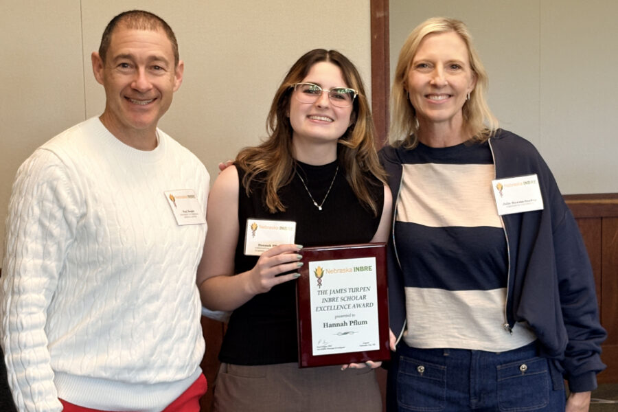 From left INBRE PI Paul Sorgen PhD&comma; Hannah Pflum&comma; 2026 Turpen Award winner&comma; and Juliane Soukup Strauss&comma; PhD&comma; of Creighton University