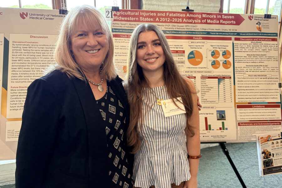 From left&comma; mentor Ellen Duysen and scholar Ashley Texel in front of Texel's poster at the annual INBRE Research Conference