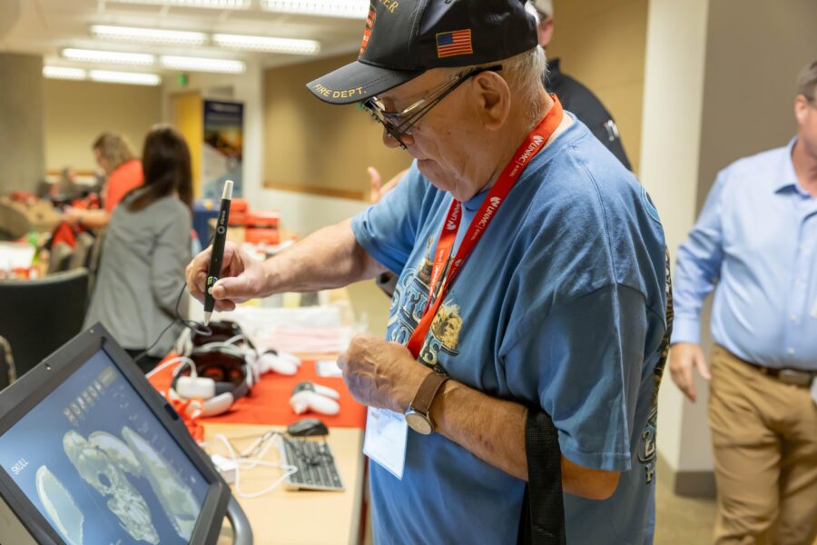 An attendee at the Activate EMS Symposium uses a desktop VR tool&period;