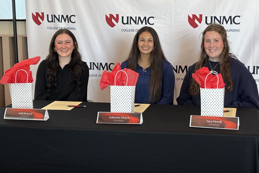 From left&comma; Addisyn Rickard of Kearney Public Schools and Katherine Khayat and Taya Moseley of Kearney Catholic Schools signed &OpenCurlyDoubleQuote;letters of intent&rdquo; to enter the UNMC nursing program at the event&period;