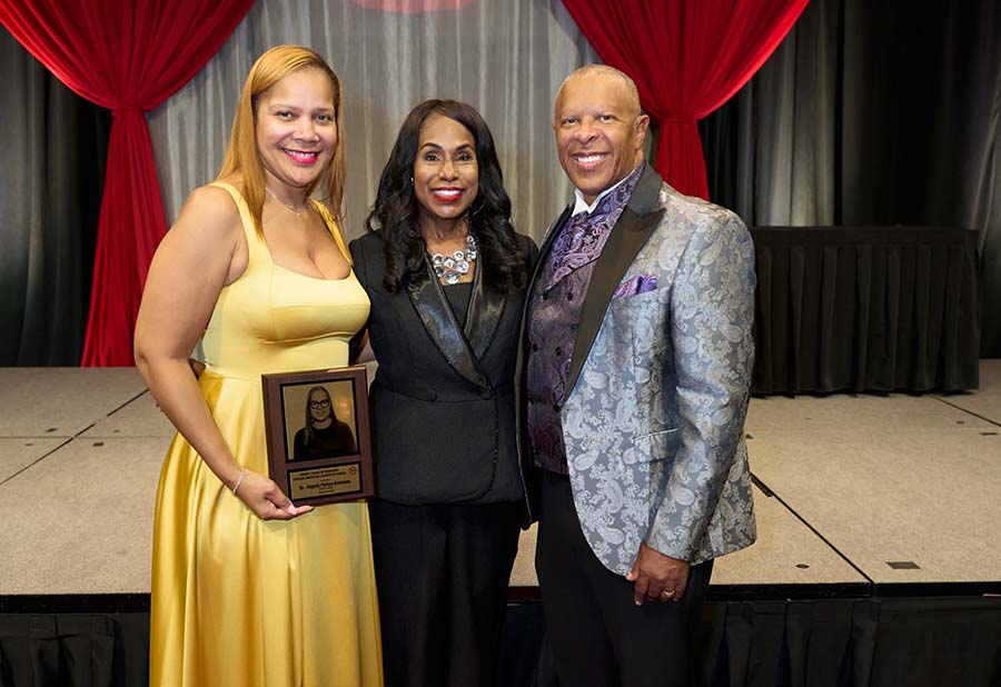 Angela Felton-Coleman, PhD student, left, received an African American Leadership Award as a healthcare leader from the Urban League of Nebraska.