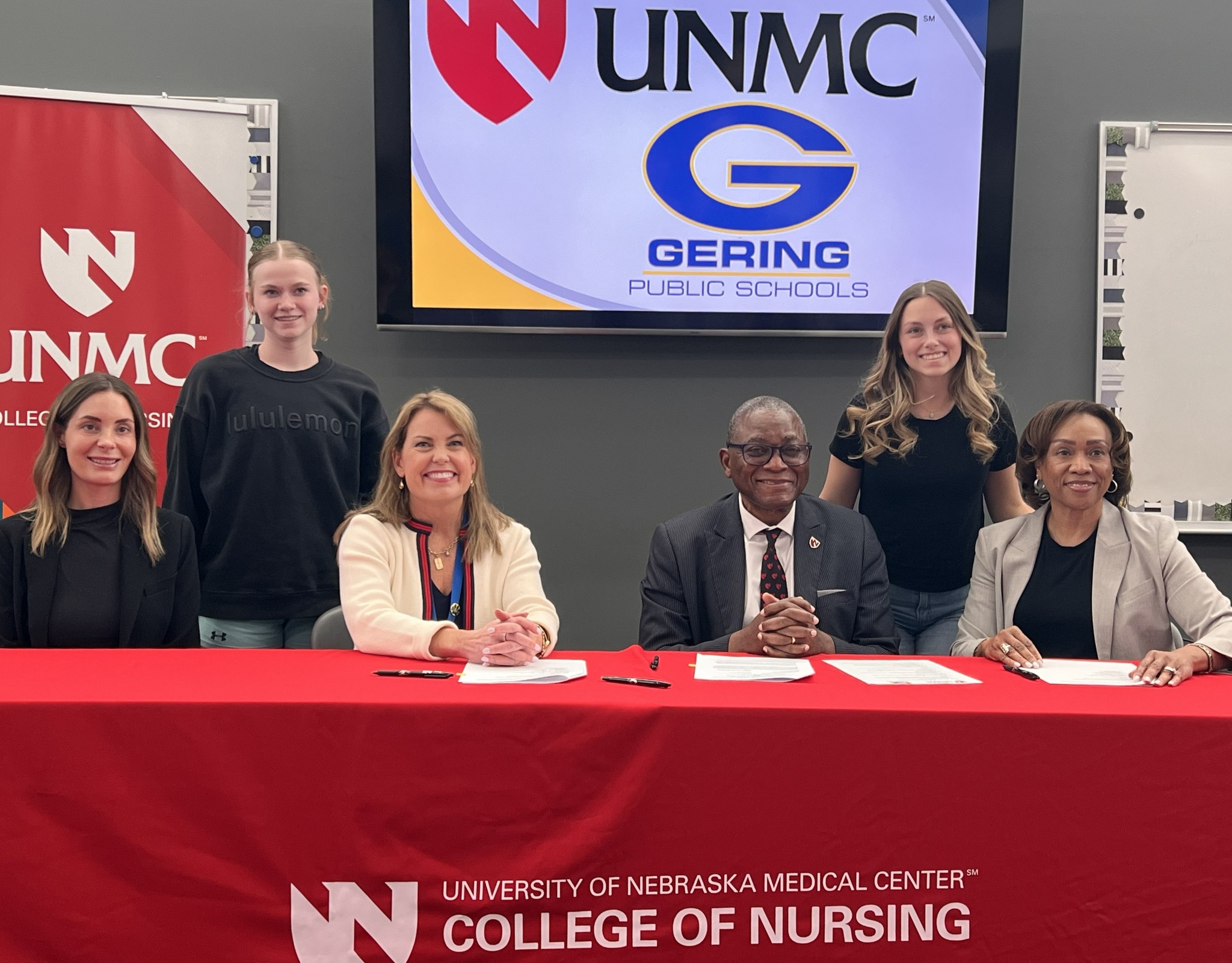 Representatives of Gering Public Schools and UNMC signing a memorandum of understanding.