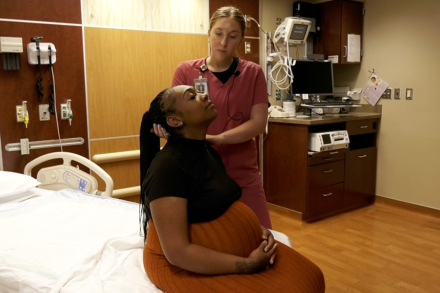 Student providing support to a patient