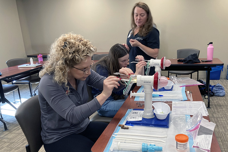 Dr. Carlson and residents perform gynecological procedure simulations