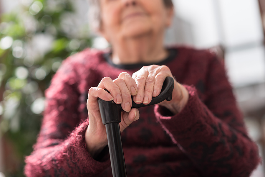 elderly woman with a cane