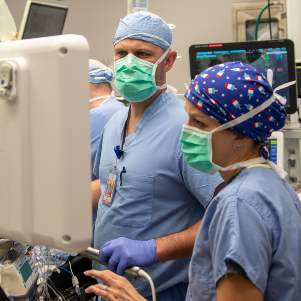 doctor looking at medical equipment