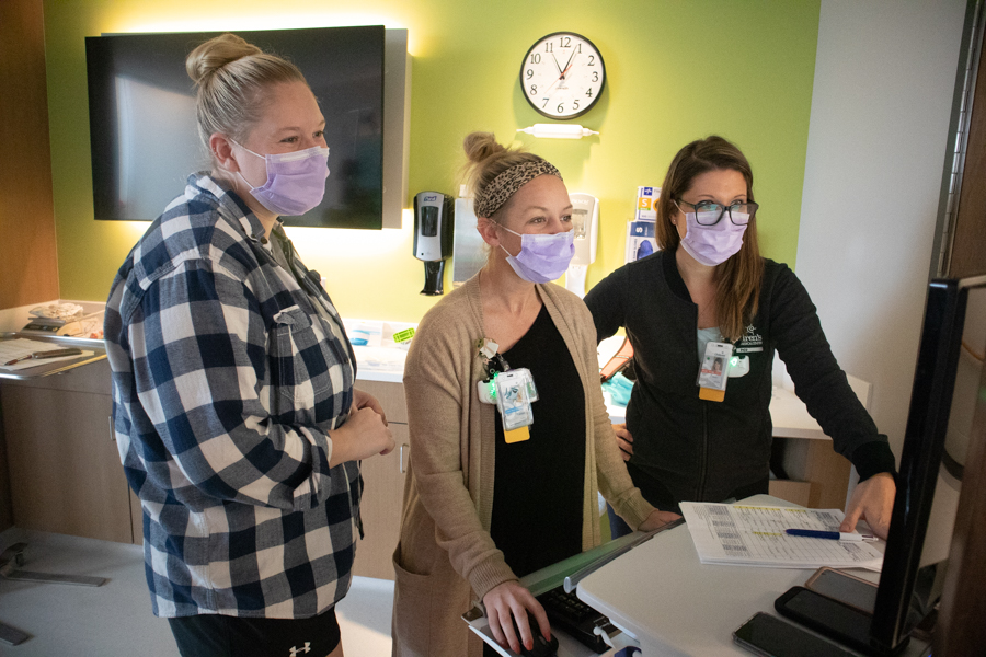 medical staff surrounding infant