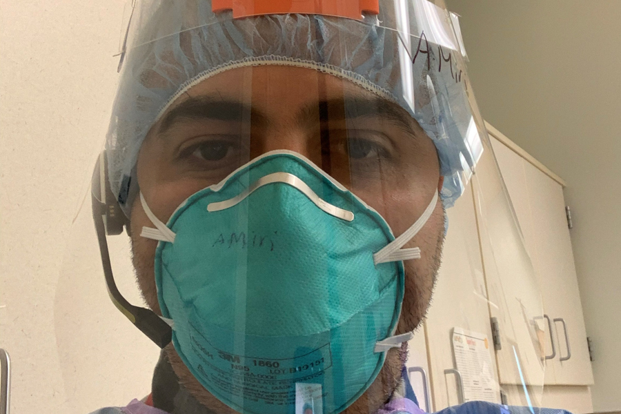 fellow in medical mask in operating room