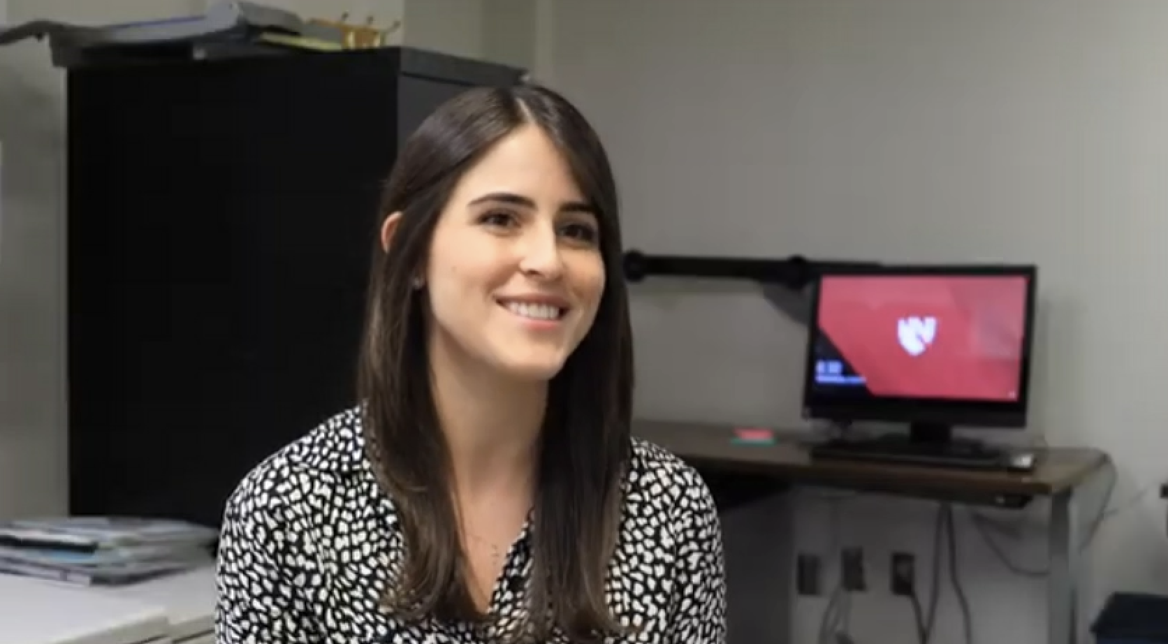 woman smiling mid conversation