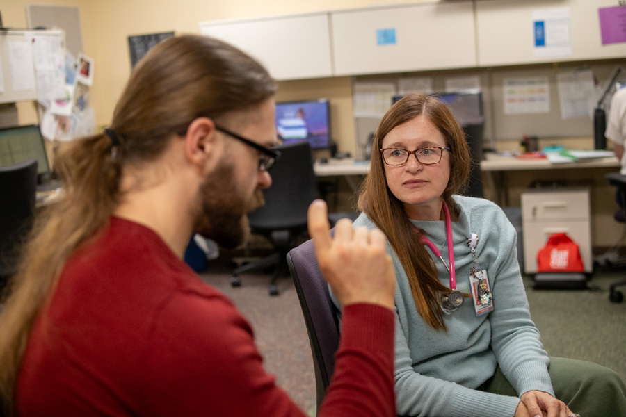 Fellow presents case to attending