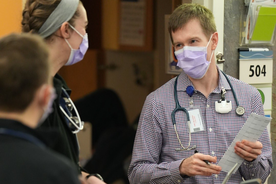 Dr. Coulter talking with staff