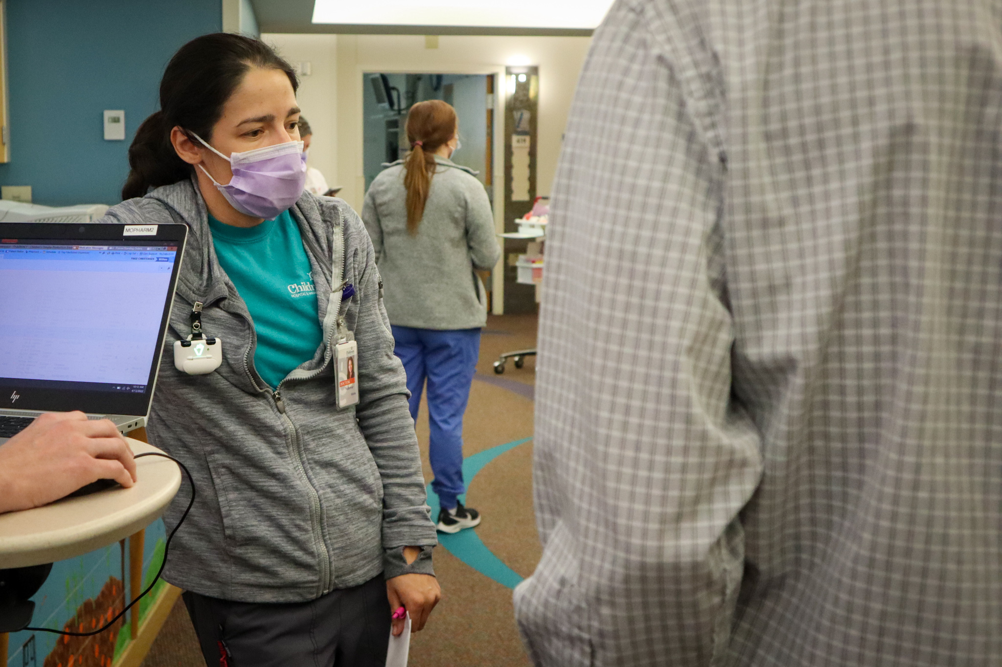 doctor looking introspectively while talking to a fellow about a case