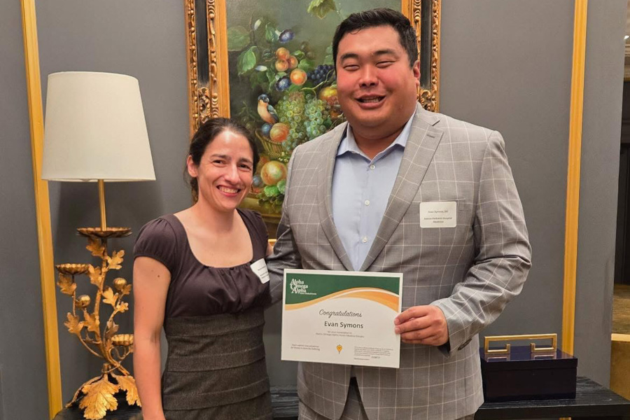 program director and fellow photographed together with diploma